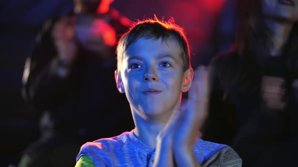 Surprised Boy Clap Hands in Circus To the Acrobatic and Magic Show Artists