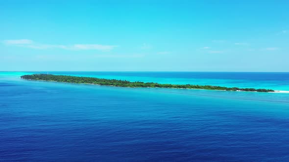 Aerial scenery of idyllic resort beach journey by aqua blue ocean and white sandy background of a da