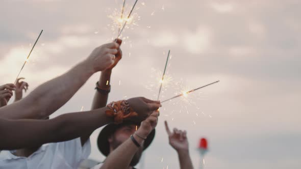 People with Sparklers Partying Outdoors