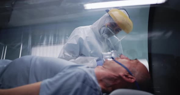 Senior Man in Respirator Talking with Doctor