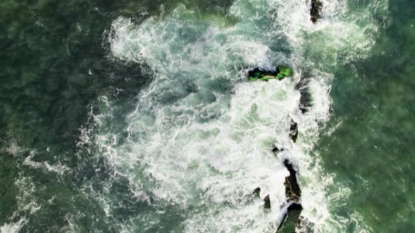 Aerial shoot of the sea wave. Camera hangs over the waves.