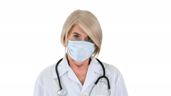 Elder Doctor or Nurse Taking Off Medical Mask Smiling on White Background