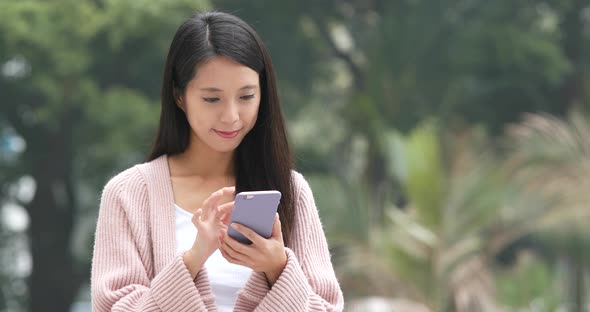 Woman Use of Mobile Phone at Outdoor