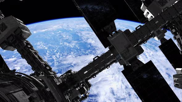 International Space Station in Outer Space Over the Planet Earth alt