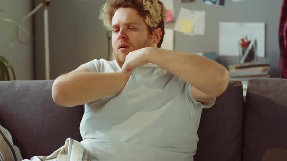 Sick Man Measuring Temperature at Home