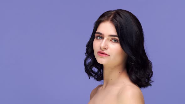 Studio portrait of young and beautiful brunette woman.