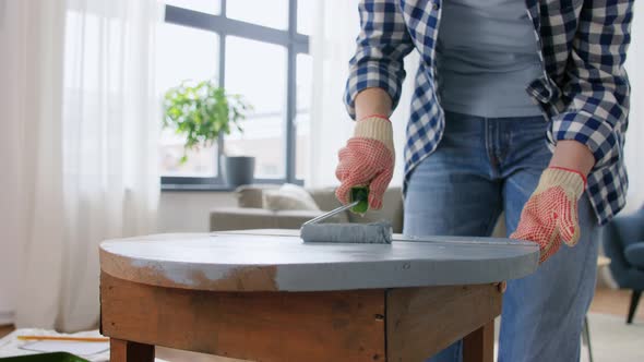 Woman Painting Old Wooden Table with Grey Color