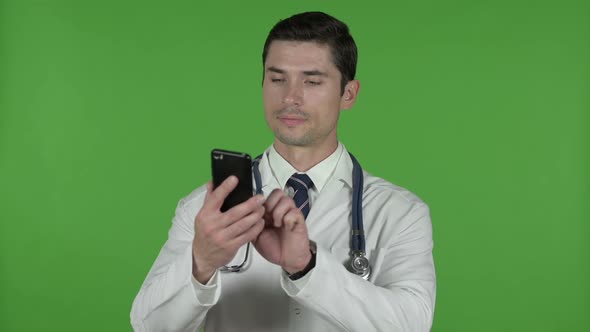 Ambitious Young Doctor Using His Cellphone Chroma Key