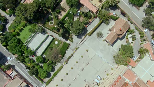 Exotic Barcelona buildings with palm trees, aerial top down view