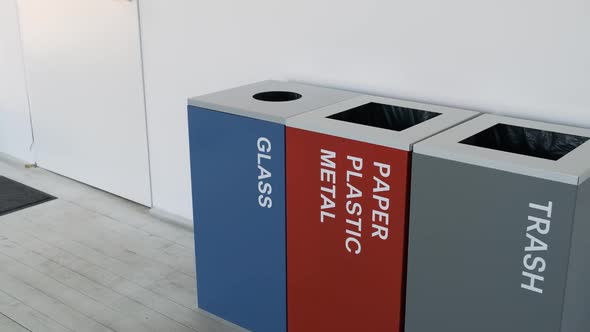 Plastic Bins, Garbage Cans, Recycling. Colorful, Plastic Garbage Bins, with Recycle Logo Stacked in