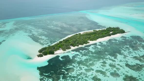 Aerial Drone Video of an Abandoned Island with a Sandbar in Maldives