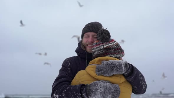 Portrait of Beautiful Happy Couple Hugging Together and Expressing Affection While Resting on Nature