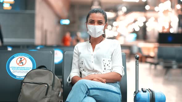 Passenger Smiling at Camera at Airport