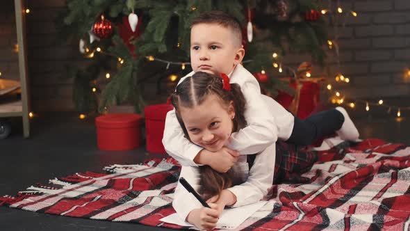 Kids Writing Letter To Santa on Christmas