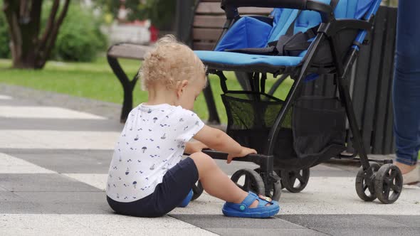 Mother and Little Child Walk in the Park in Summer Happy Kid Having Fun Playing on Footpath with