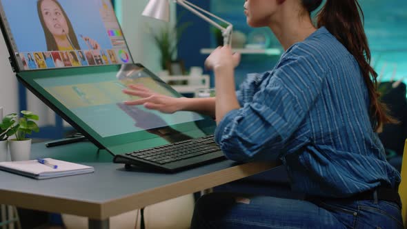 Woman Photographer Doing Retouch Work on Touch Screen