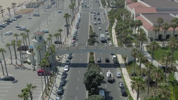 Drone flying away from Huntington Beach cross walk on PCH.