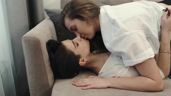 Two Young Stylish Cool Women Affectionate Lesbian Lgbtq Couple Dating in Love Relaxing at Home