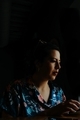 Girl under a dark background with a little entrance of light in her face  - PhotoDune Item for Sale