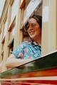 Girl looking through the window outdoors smiling  - PhotoDune Item for Sale