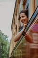 Girl looking through the window outdoors smiling - PhotoDune Item for Sale