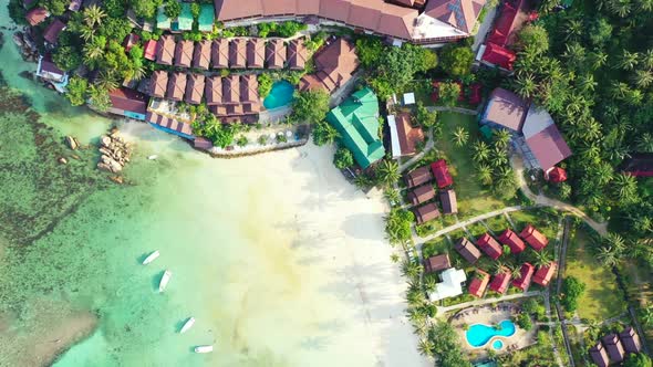 Aerial drone shot abstract of paradise sea view beach break by shallow sea and bright sandy backgrou