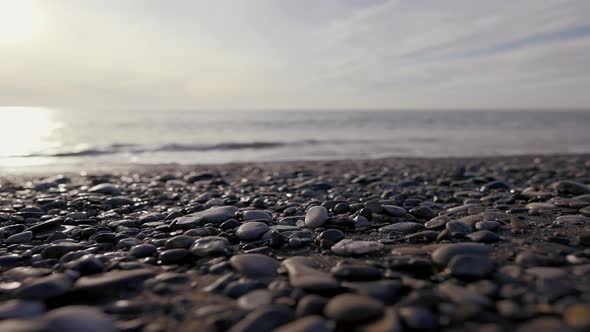 Pebble Beach with Small Pebbles and Sea Waves