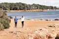 2 kids walking on cliffs by the sea. From behind - PhotoDune Item for Sale