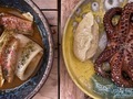 Close up of tapas plates of octopus and squid.  - PhotoDune Item for Sale