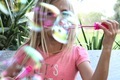 Girl blowing bubbles in spring - PhotoDune Item for Sale