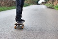 Riding a skateboard on a road in the countryside  - PhotoDune Item for Sale