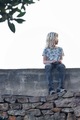 Boy sitting on a brick wall  - PhotoDune Item for Sale