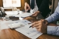 Managers are using tablets to analyze sales cost reports and explain summary reports to employees ca - PhotoDune Item for Sale
