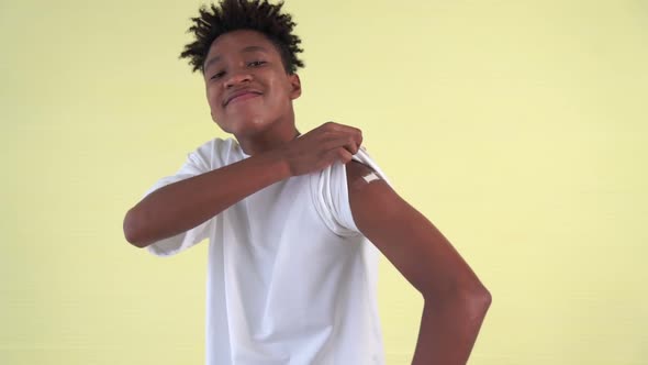 African American Teenager Showing COVID19 Vaccine Bandage Merrily