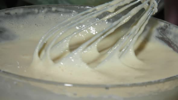 Housewife Mixes White Pancakes Dough with Flour in Bowl