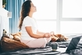 Woman meditating at the bed - PhotoDune Item for Sale