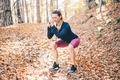 Woman have making sport exercise at autumn forest. - PhotoDune Item for Sale