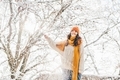 Portrait of smiling woman enjoying snow day. - PhotoDune Item for Sale