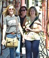 Candid photo of three women walking down a street , smiling happy casual  - PhotoDune Item for Sale