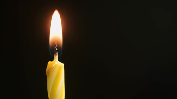 Flames Burning in the Dark Candle Macro Closeup Against a Dark Background Slow Motion