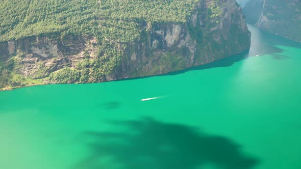 Boat Sailing At Calm Green Water Of Geiranger Fjord On A Sunny Day In Summer In Sunnmore, More og Ro