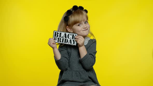 Child Girl Showing Black Friday Inscription, Smiling, Looking Satisfied with Low Prices, Discounts