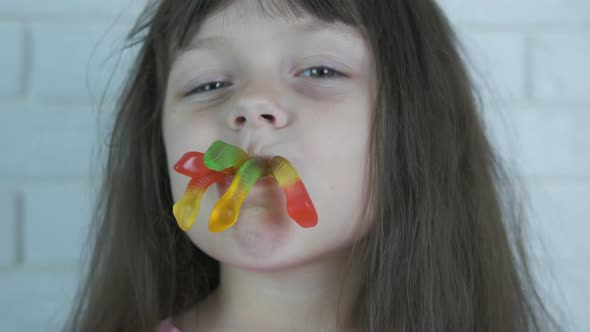 A Child with Candy Worms.