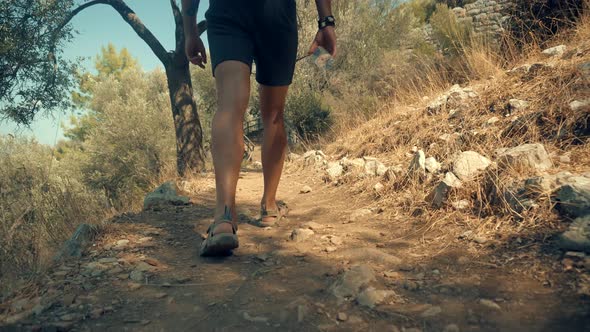 Man Walks Shoot Mobile Photo In Ancient Town Turkey Kemer Archeology. Tourist Photo Smartphone.