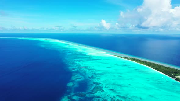 Aerial above nature of idyllic sea view beach voyage by transparent sea with white sand background o