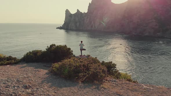 Woman Doing Yoga at Sunset