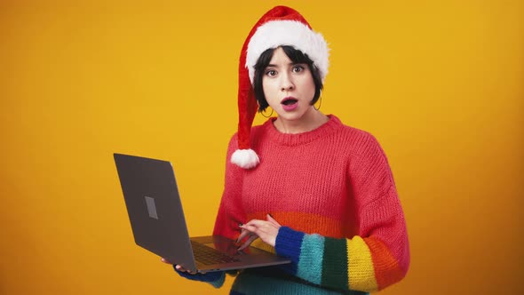 Cute Lady in Santa Hat Browsing on Laptop Enjoying Online Win Found Great App Orange Studio