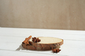natural round wooden podium for product placement, cinnamon sticks and anise stars  - PhotoDune Item for Sale
