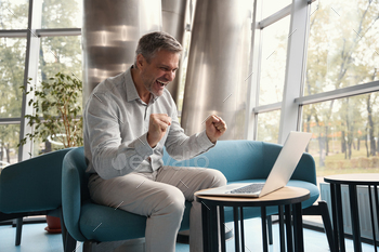 f new project, he is located with a laptop in a modern coworking