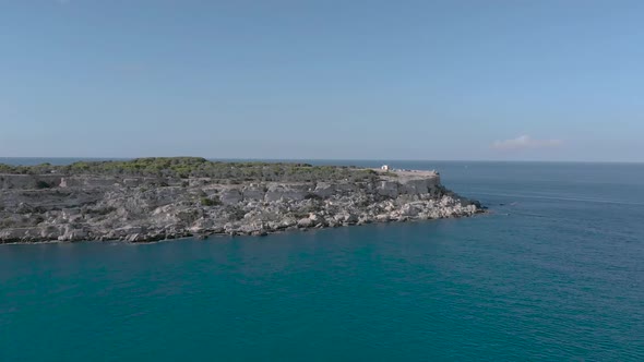 Shot over the sea going towards cliffs